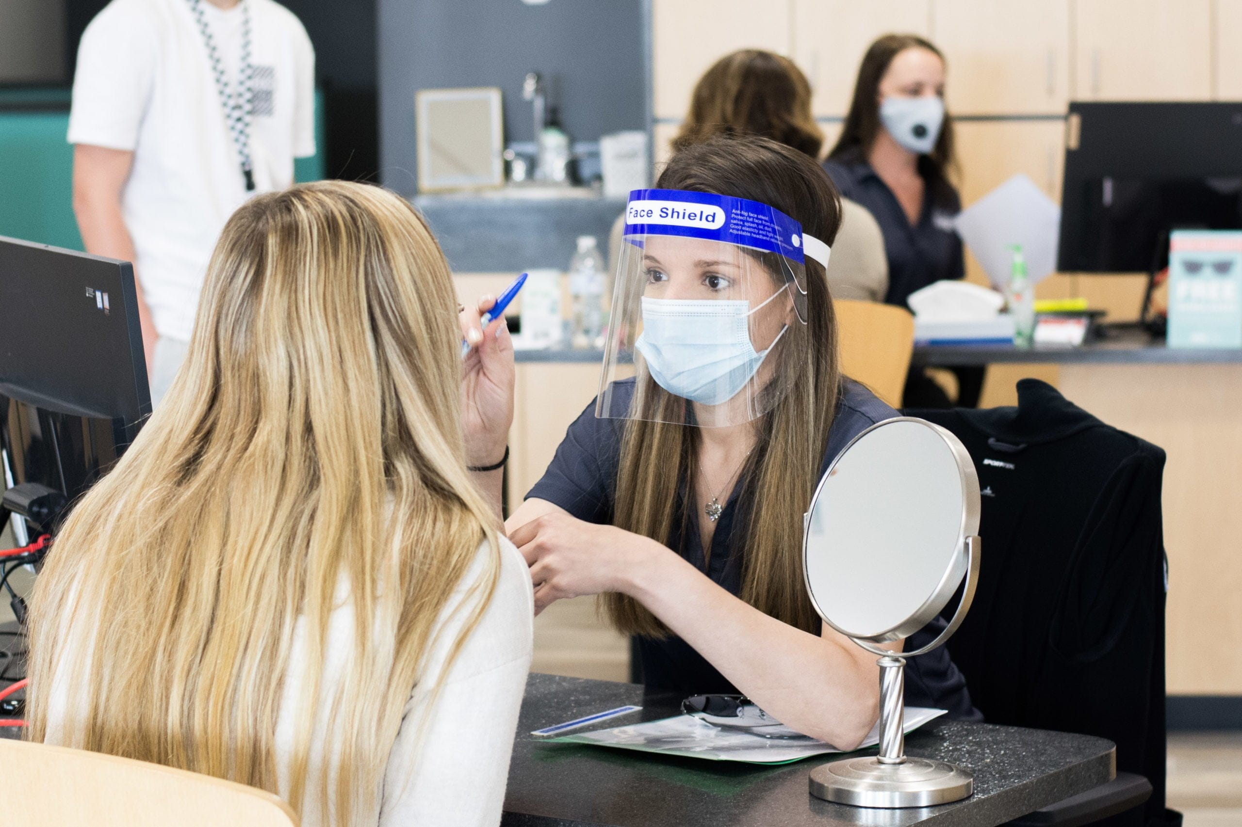 optician wearing a face shield