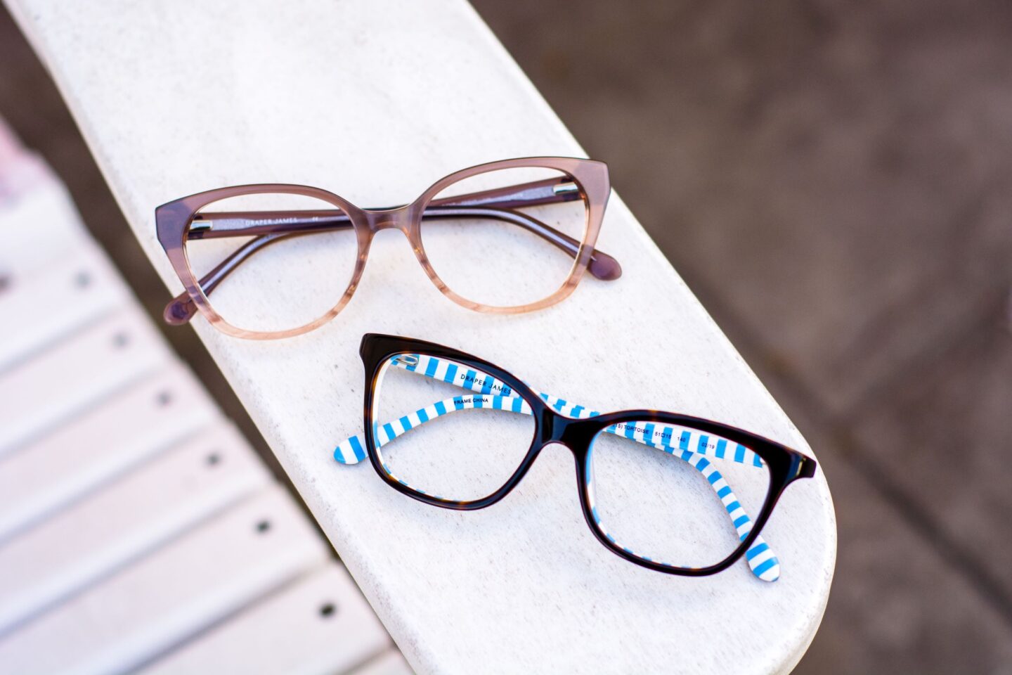 draper james glasses displayed on chair